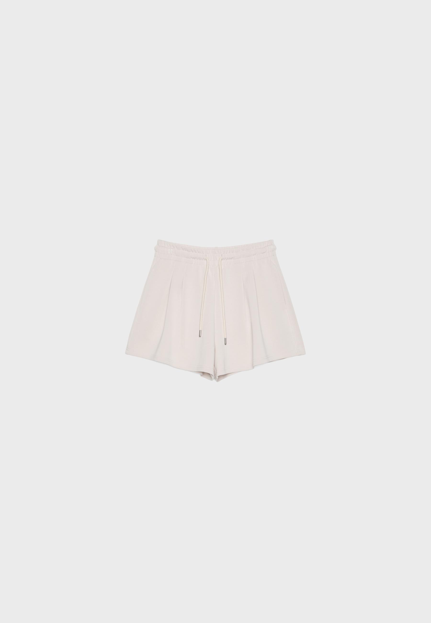 Soft-touch shorts with darts — Stone