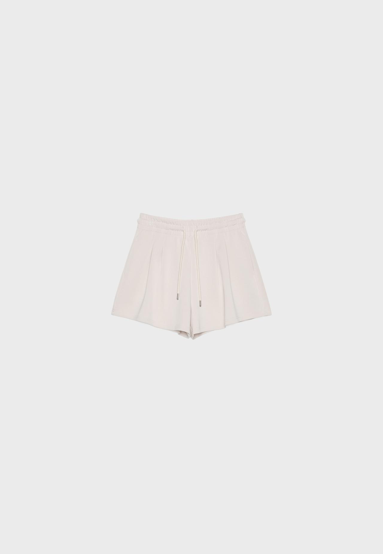 Soft-touch shorts with darts — Stone