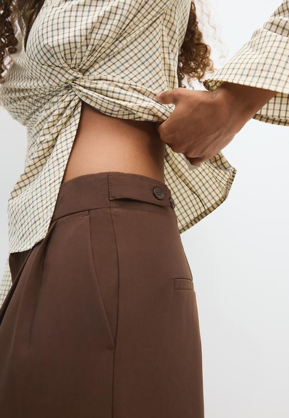 pantaloni eleganti wide leg con bottoni regolabili