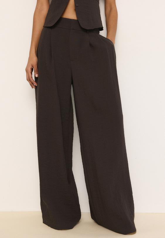 pantaloni ampi con bottoni regolabili misto lino