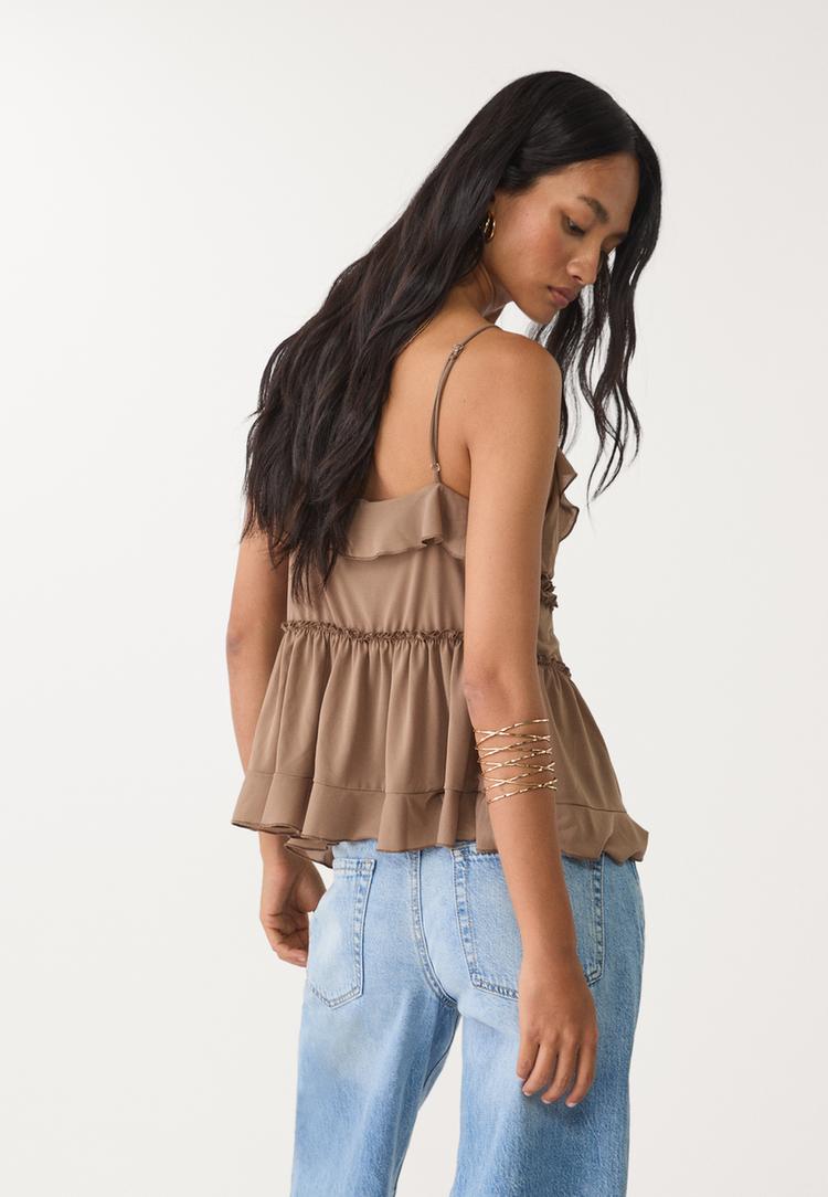 top met bandjes en volants