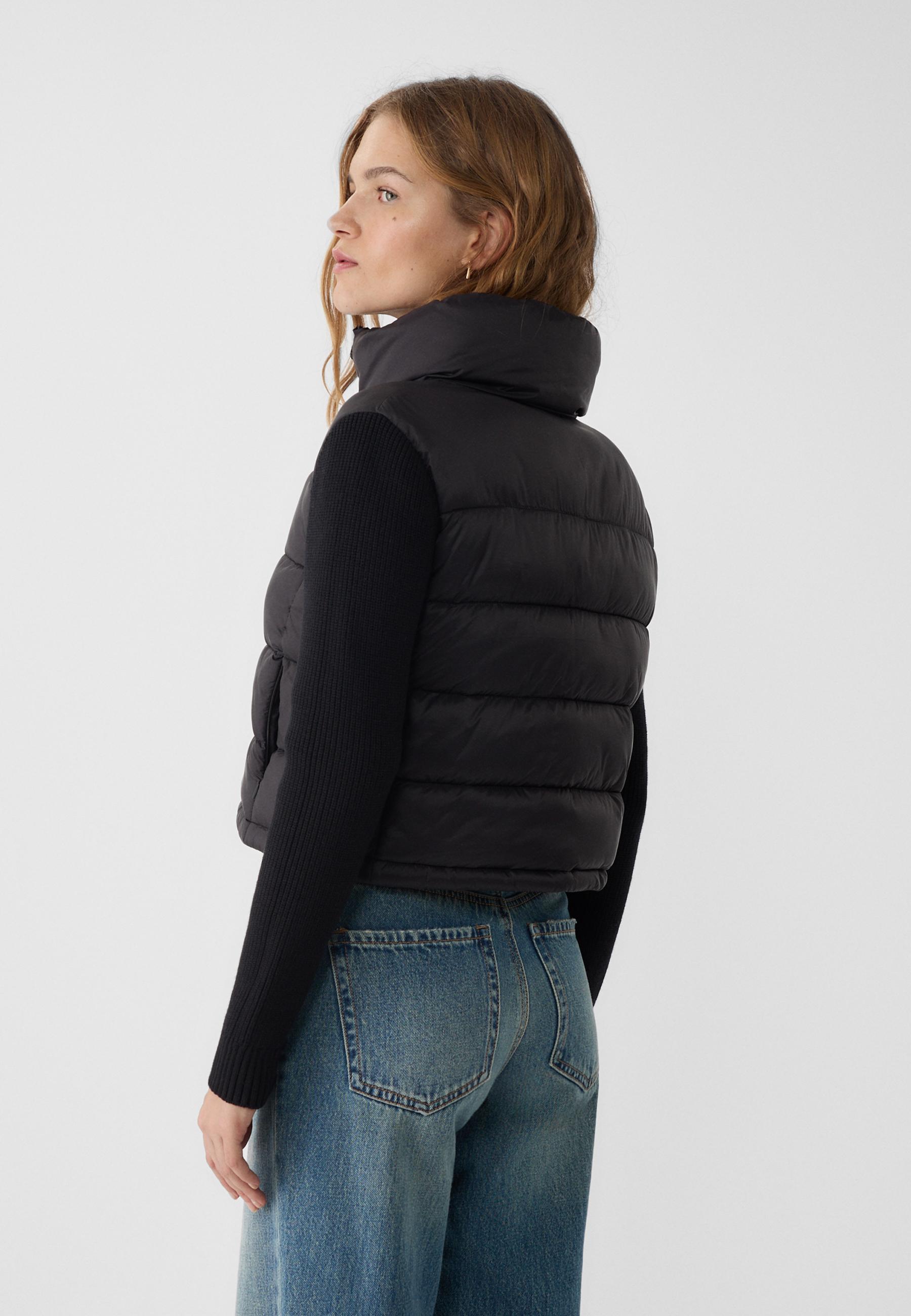 Puffer jacket with chunky knit sleeves