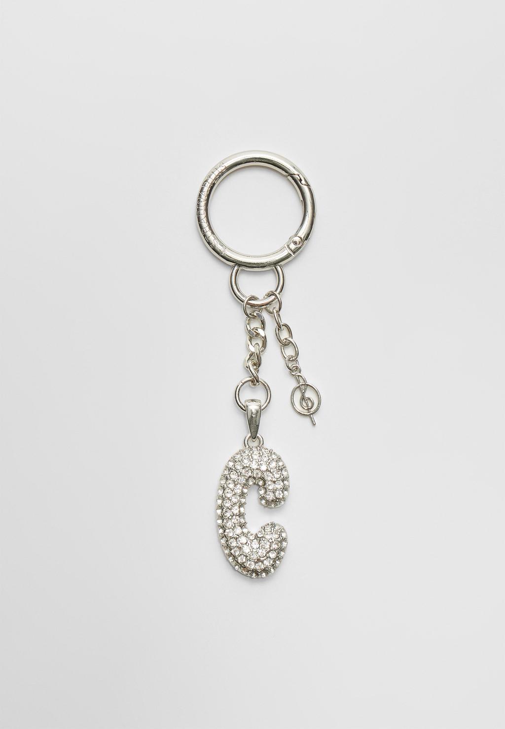 Key ring featuring an initial charm with rhinestones