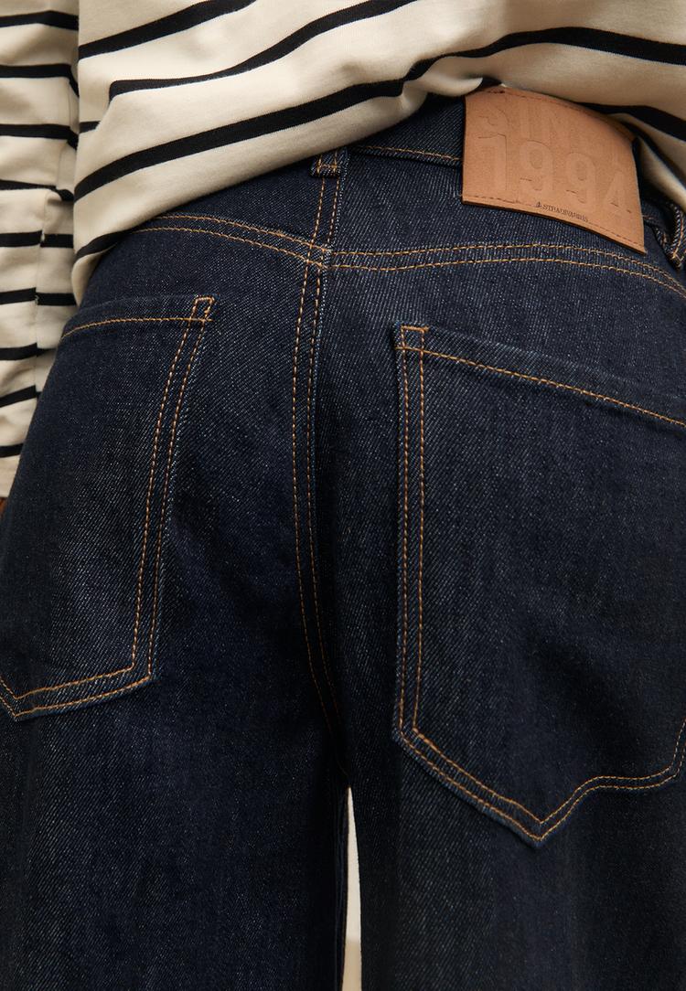 jeans wide leg detalle bajo