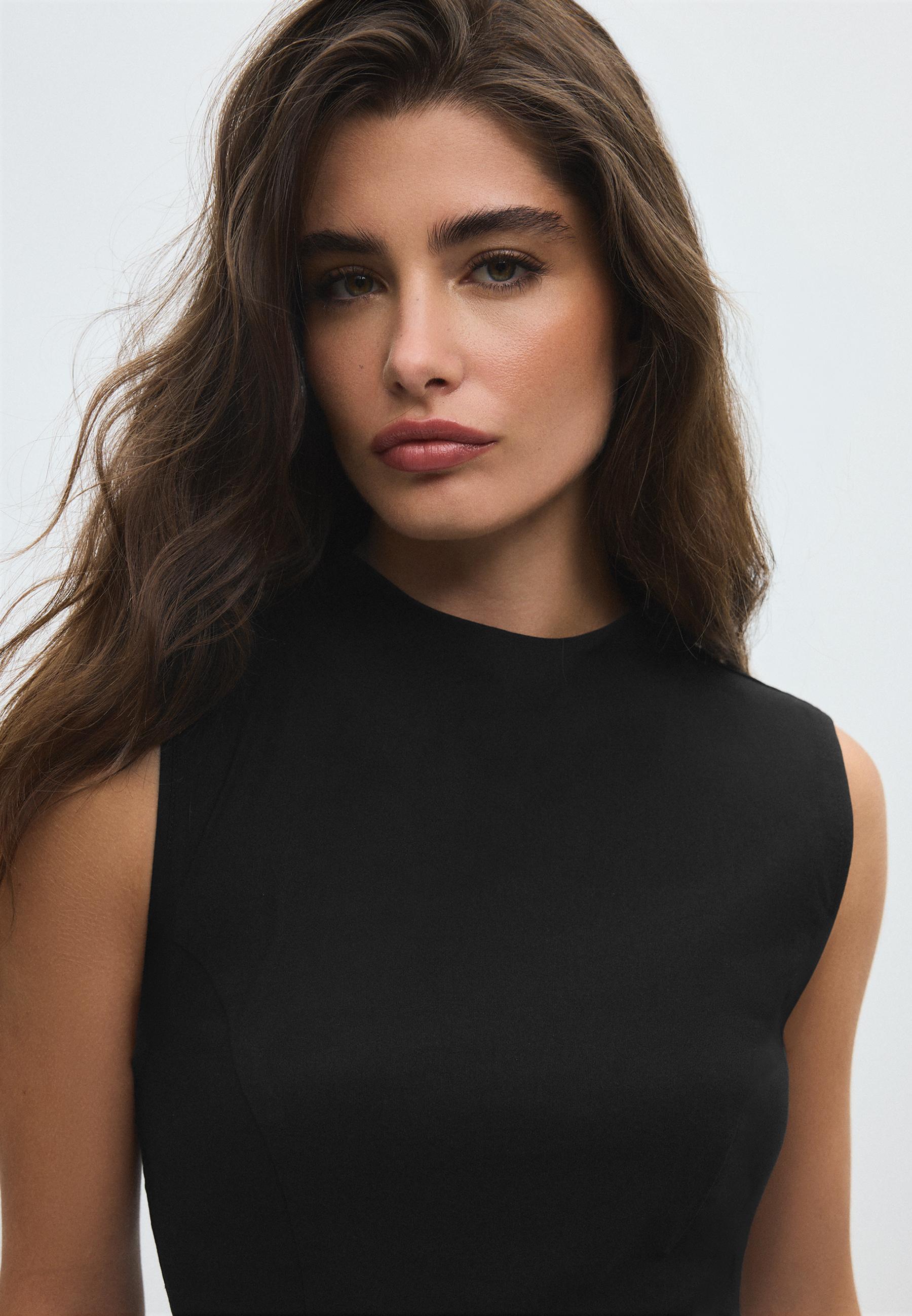 Sleeveless high-neck peplum top — Black