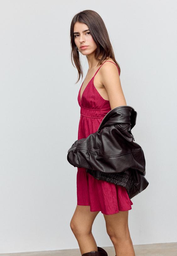 short flowing dress with tied detail at the back
