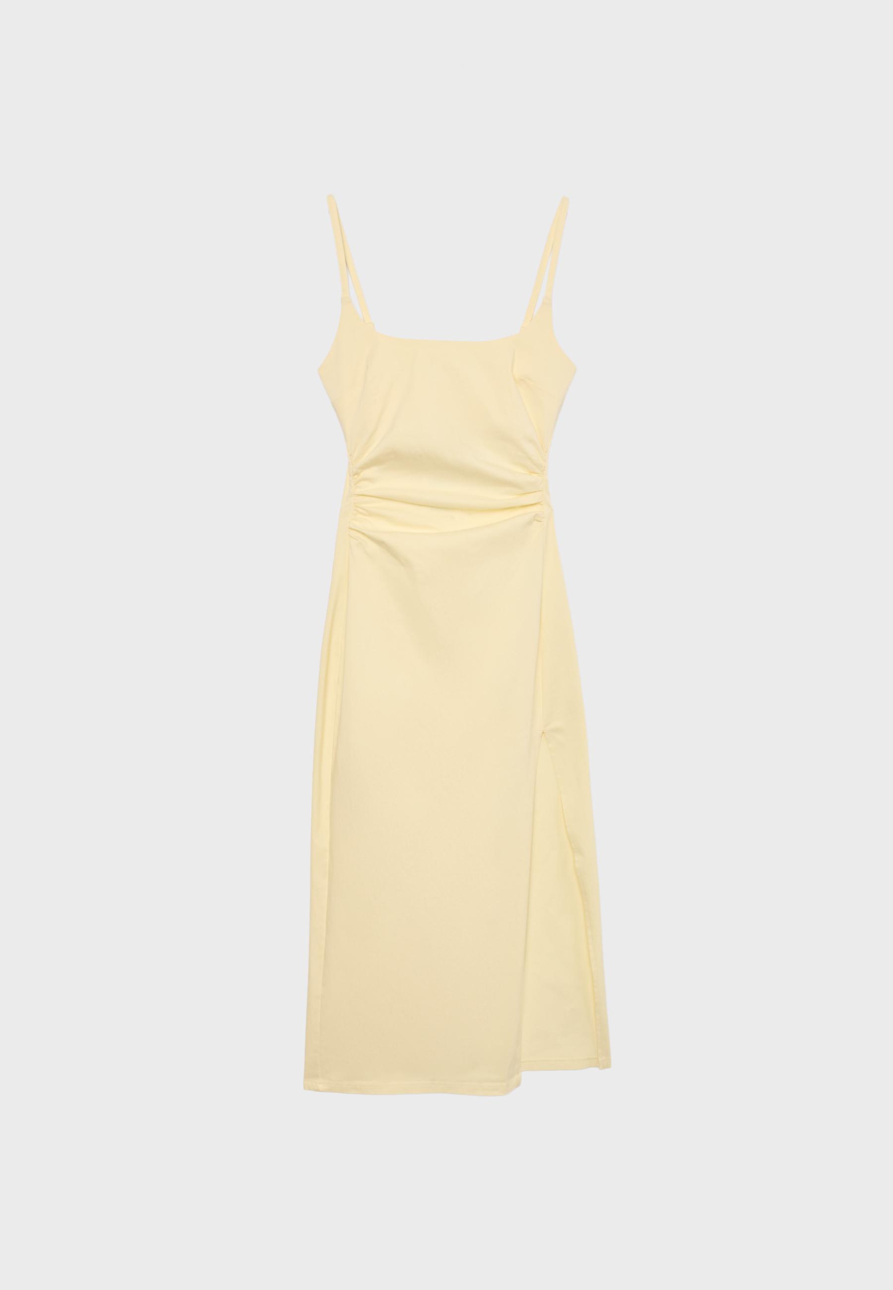 Front view of a pastel yellow dress with thin straps and a straight cut to the knee.