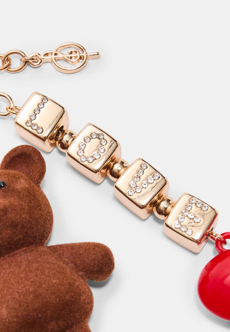 charm oso metalico