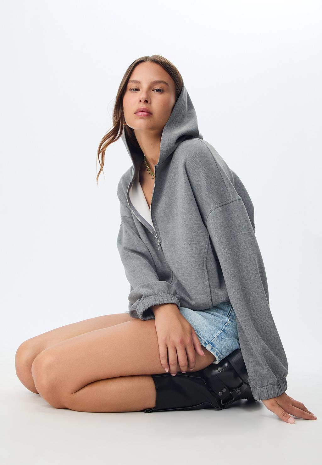 Sudadera capucha abullonada tacto suave