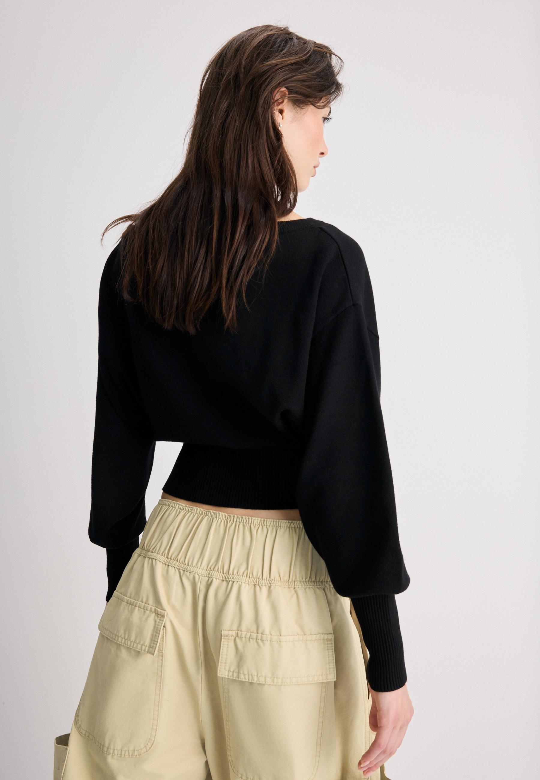 Asymmetric ribbed hem knit jumper — Black