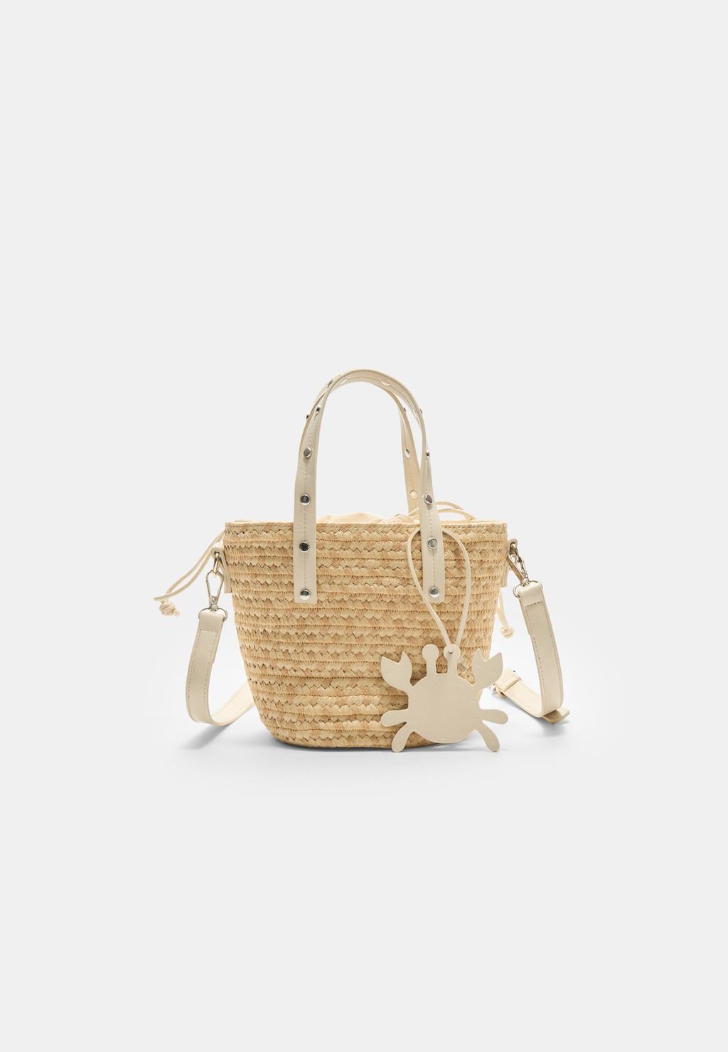 Borsa intrecciata con borchie