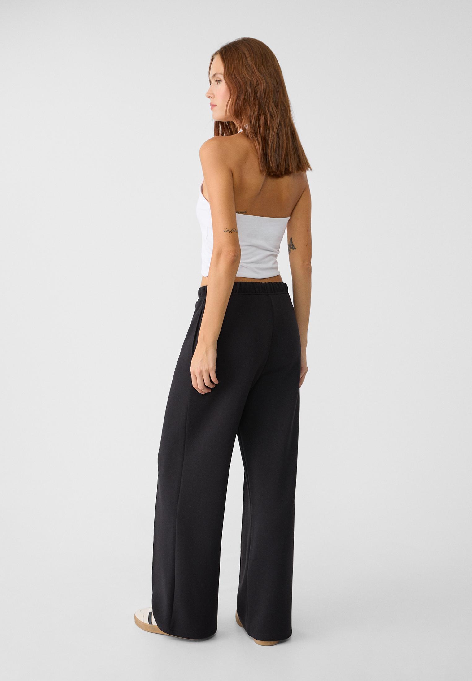 Soft-touch wide-leg pin-tuck joggers — Black