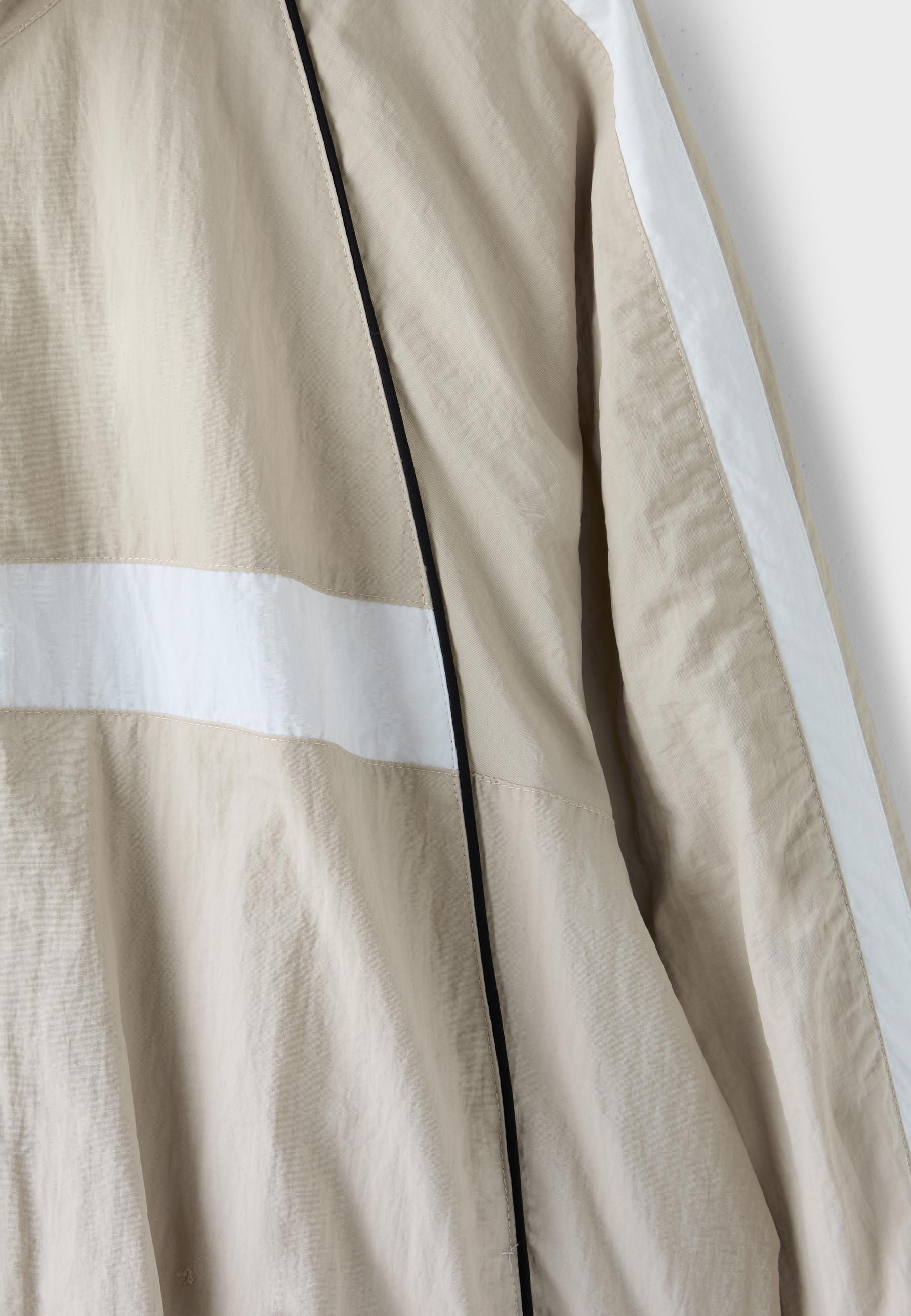 Technical windbreaker jacket — Stone