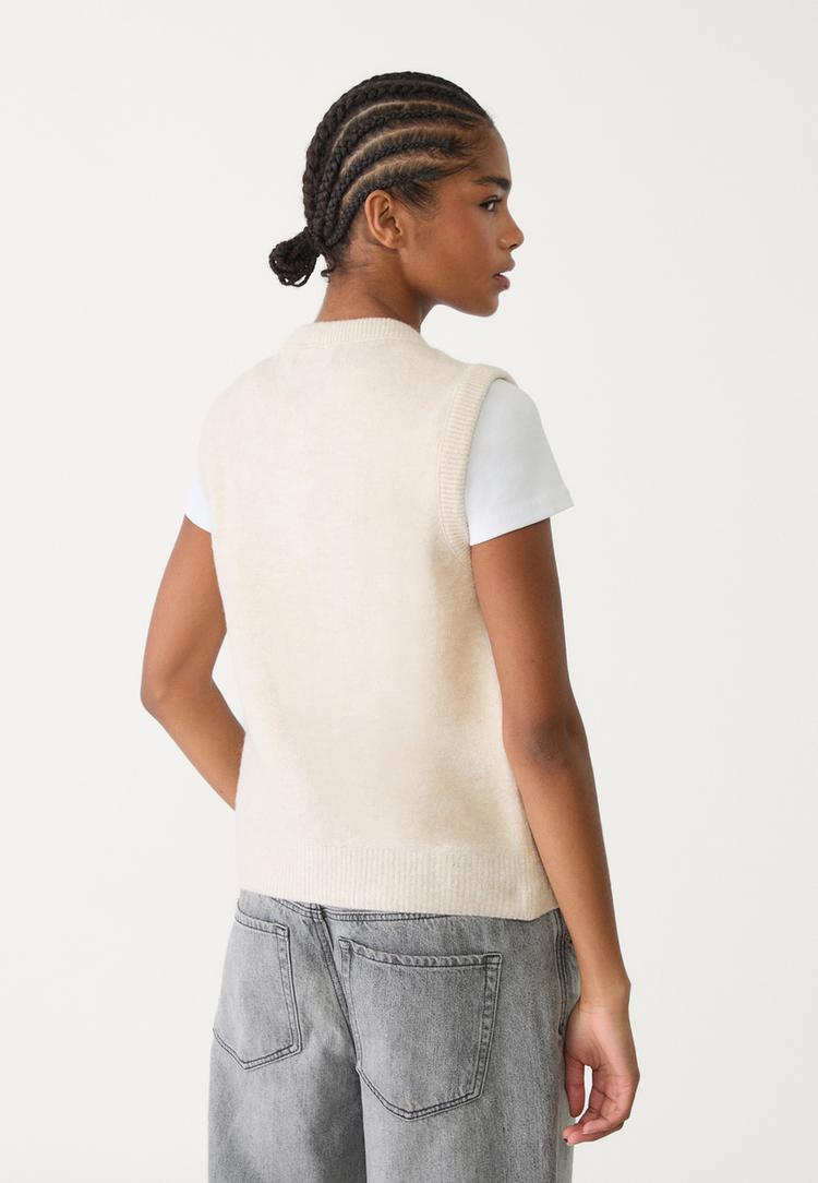 veste sans manches en maille a boutons