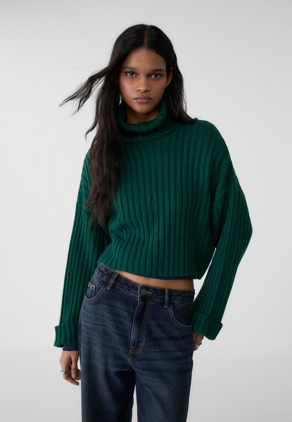 Knit jumper with raised neck