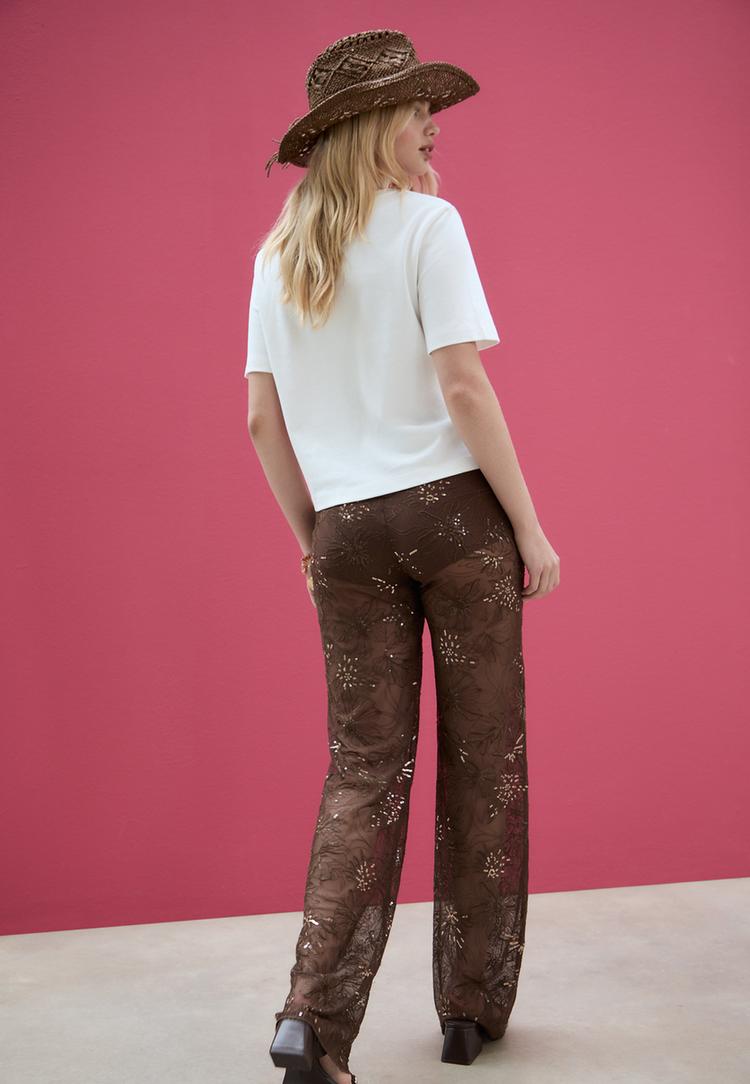 loose fitting trousers with sequinned embroidery