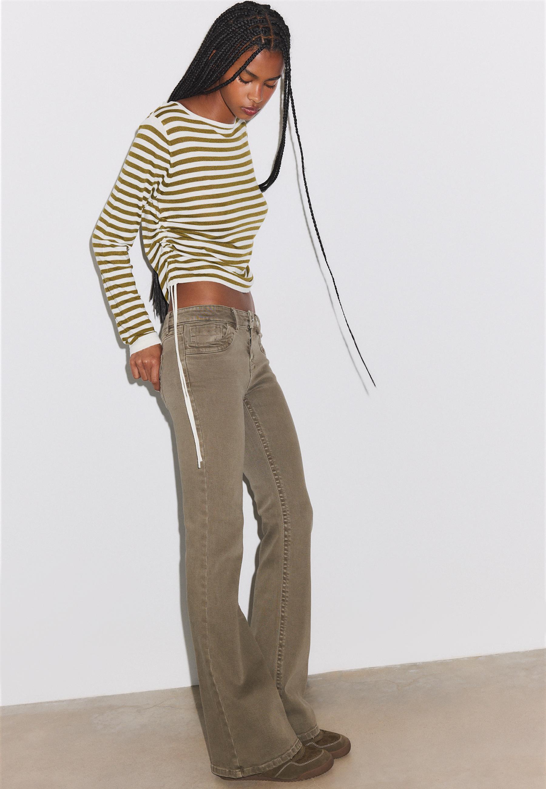 Embroidered pocket bell bottom jeans — Khaki