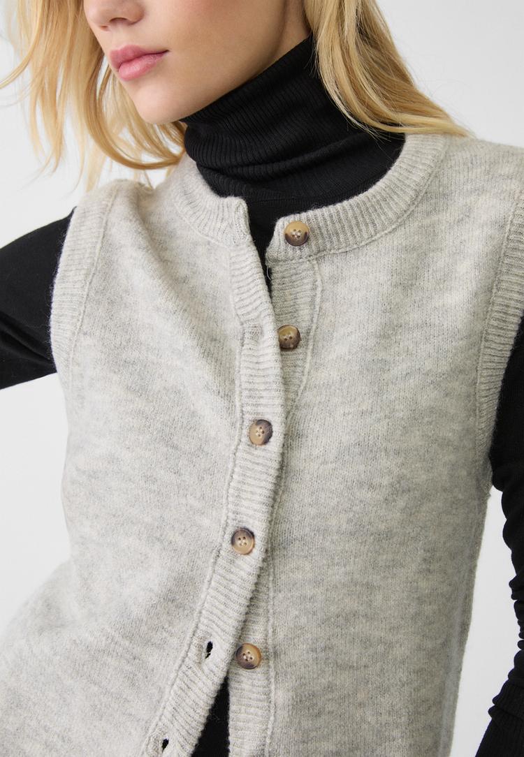 veste sans manches en maille a boutons