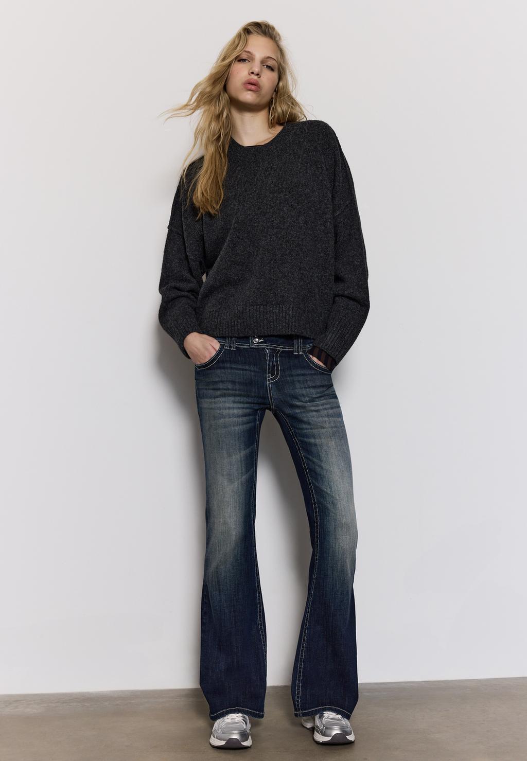 Embroidered pocket bell bottom jeans