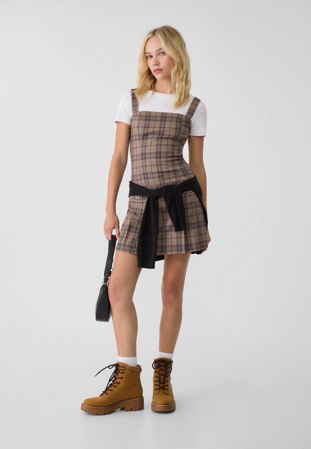 Short check dress with box pleats