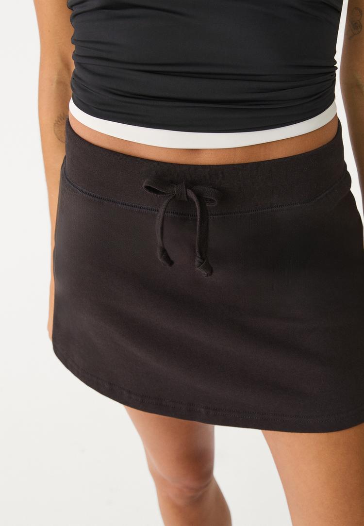 falda pantalon felpa cordones