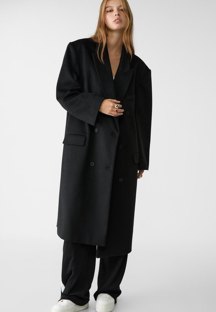 abrigo largo oversize bolsillos