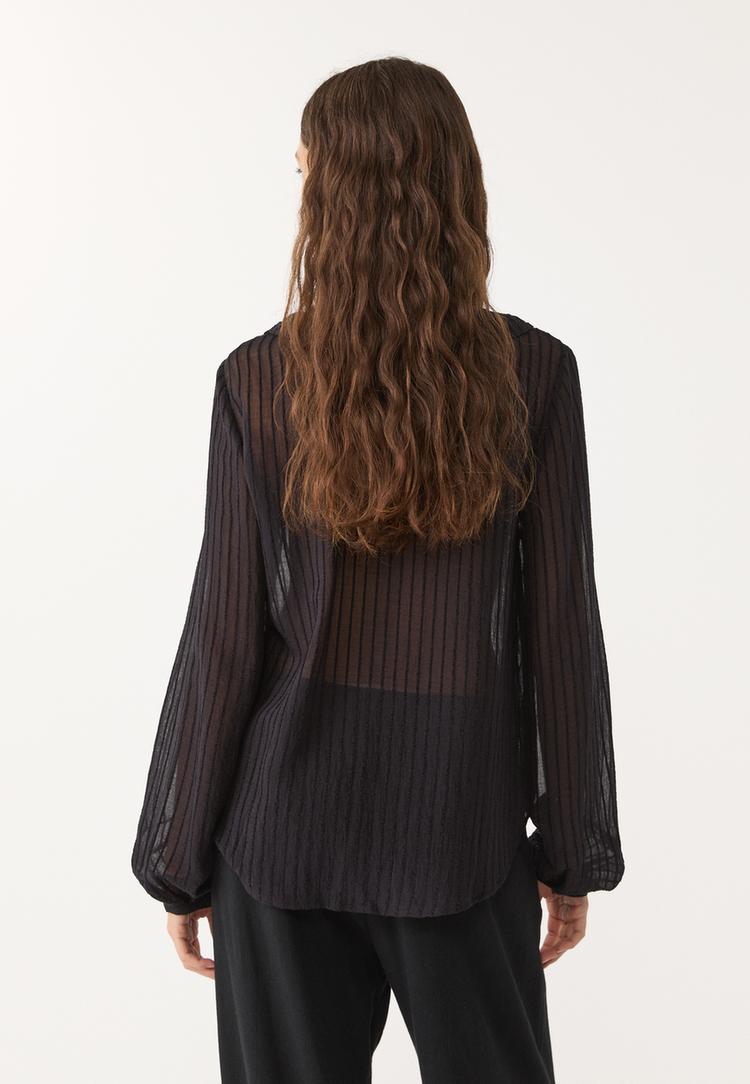 camisa fluida volantes