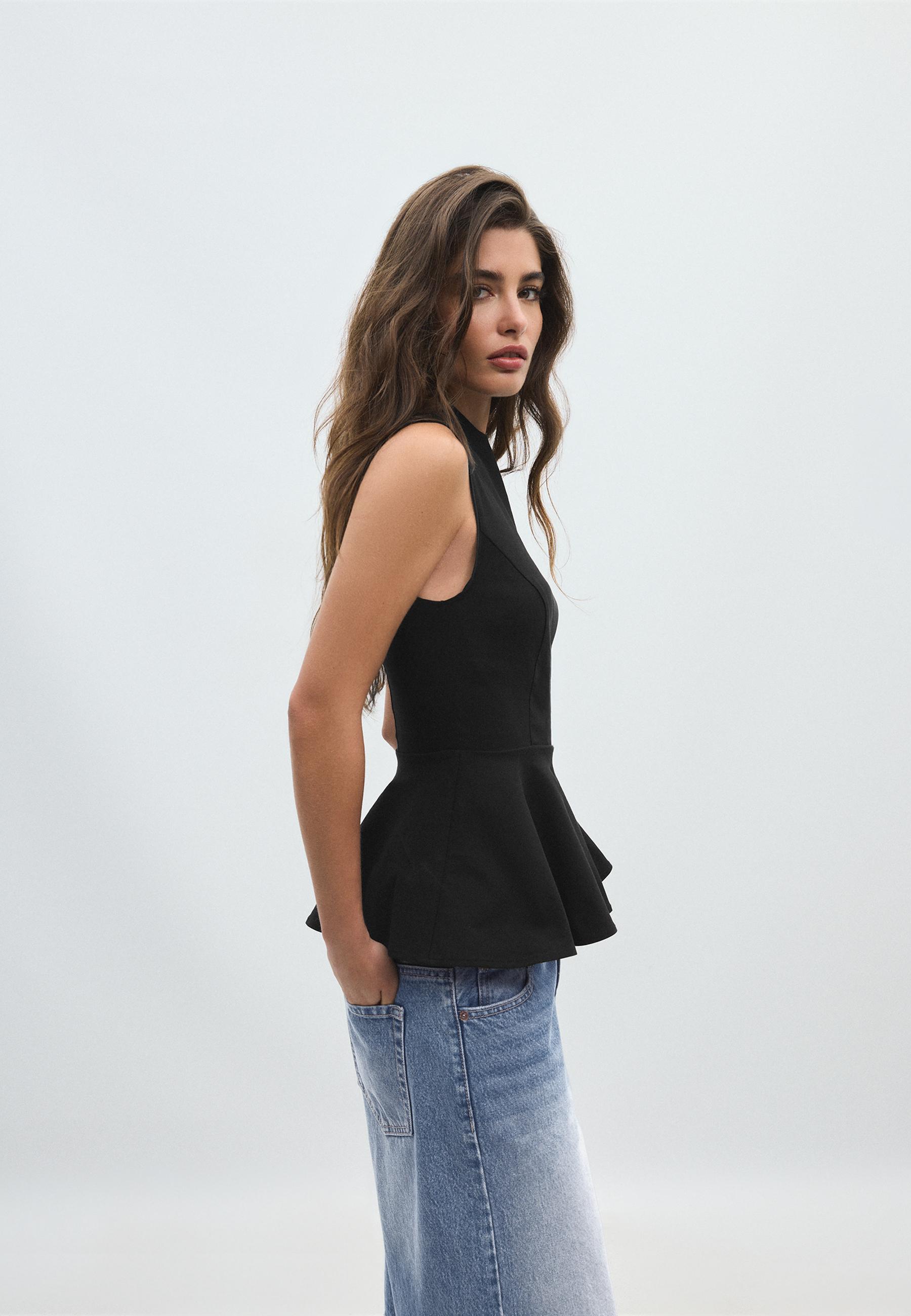Sleeveless high-neck peplum top — Black