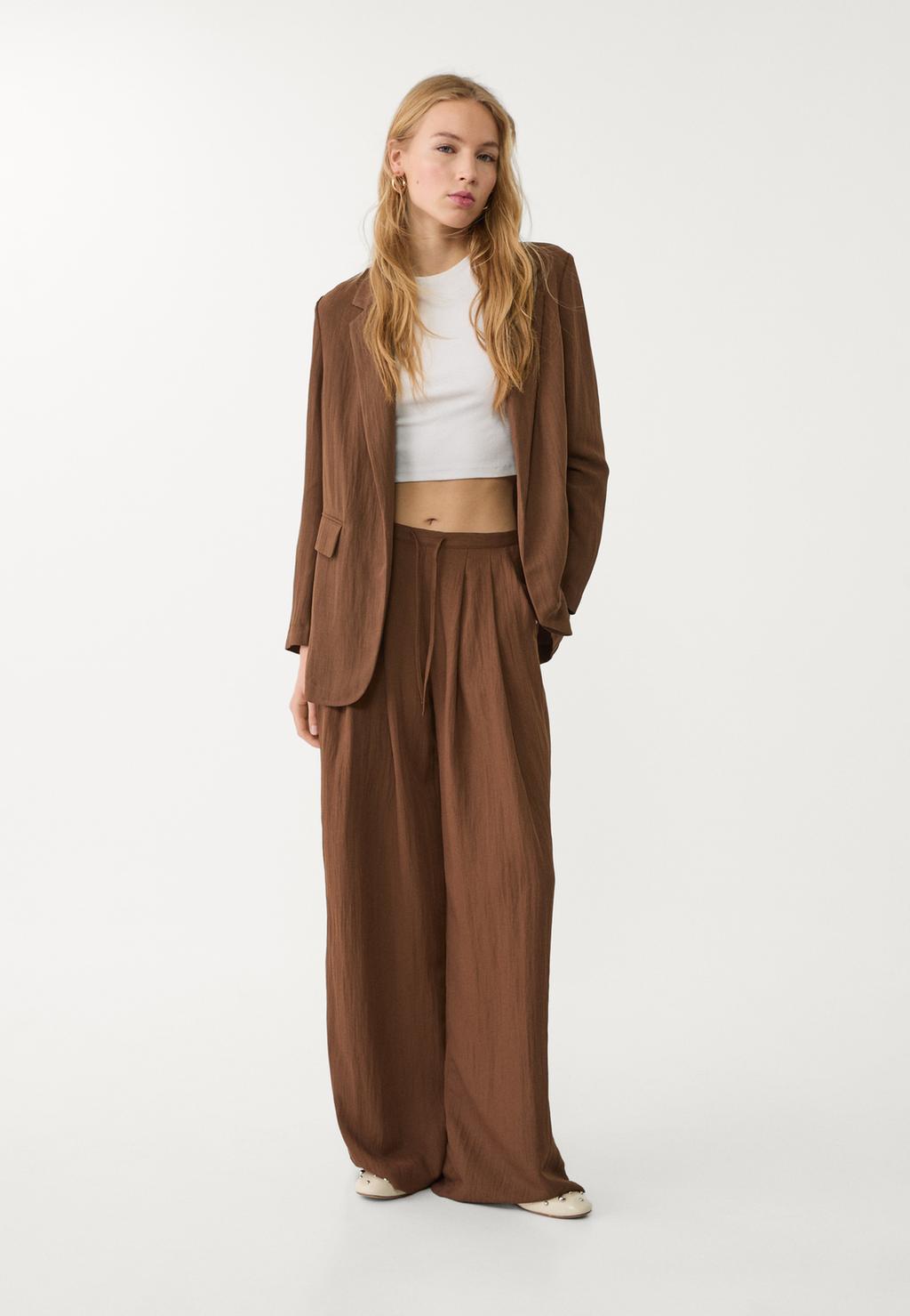 Flowing textured trousers with darts