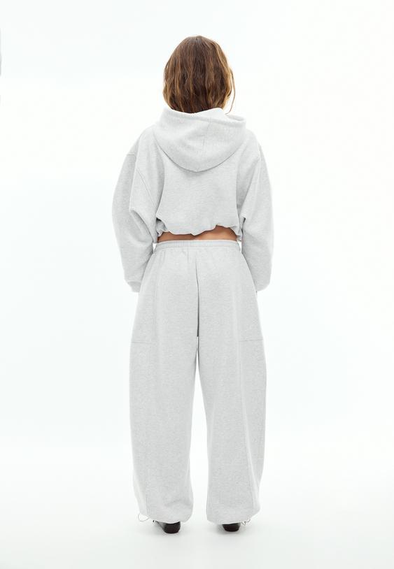 calcas jogger barrel em felpa com stoppers