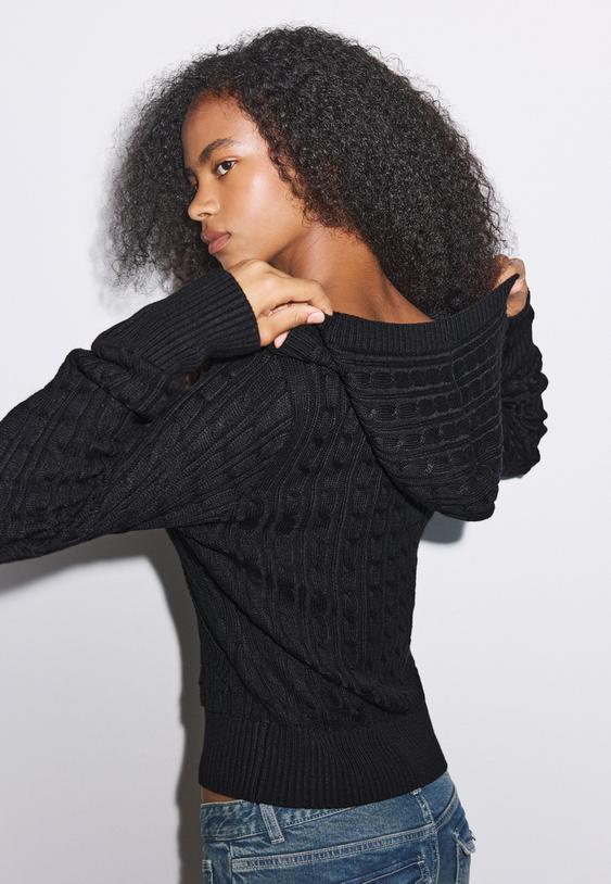 camisola de malha com trancas e capuz