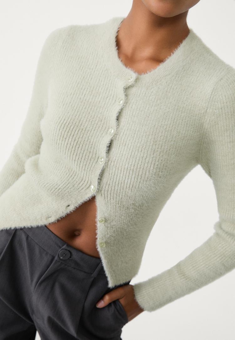 veste avec boutons en fausse fourrure