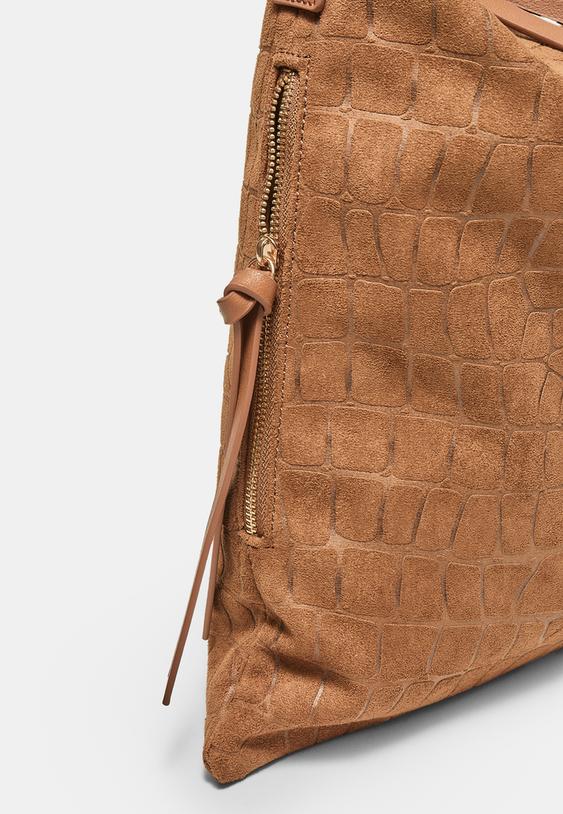 schoudertas met zachte textuur en ritsen