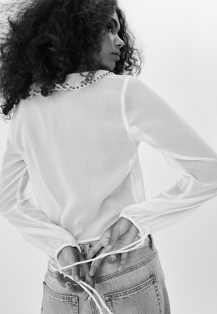 blouse met geborduurde ruches en studs