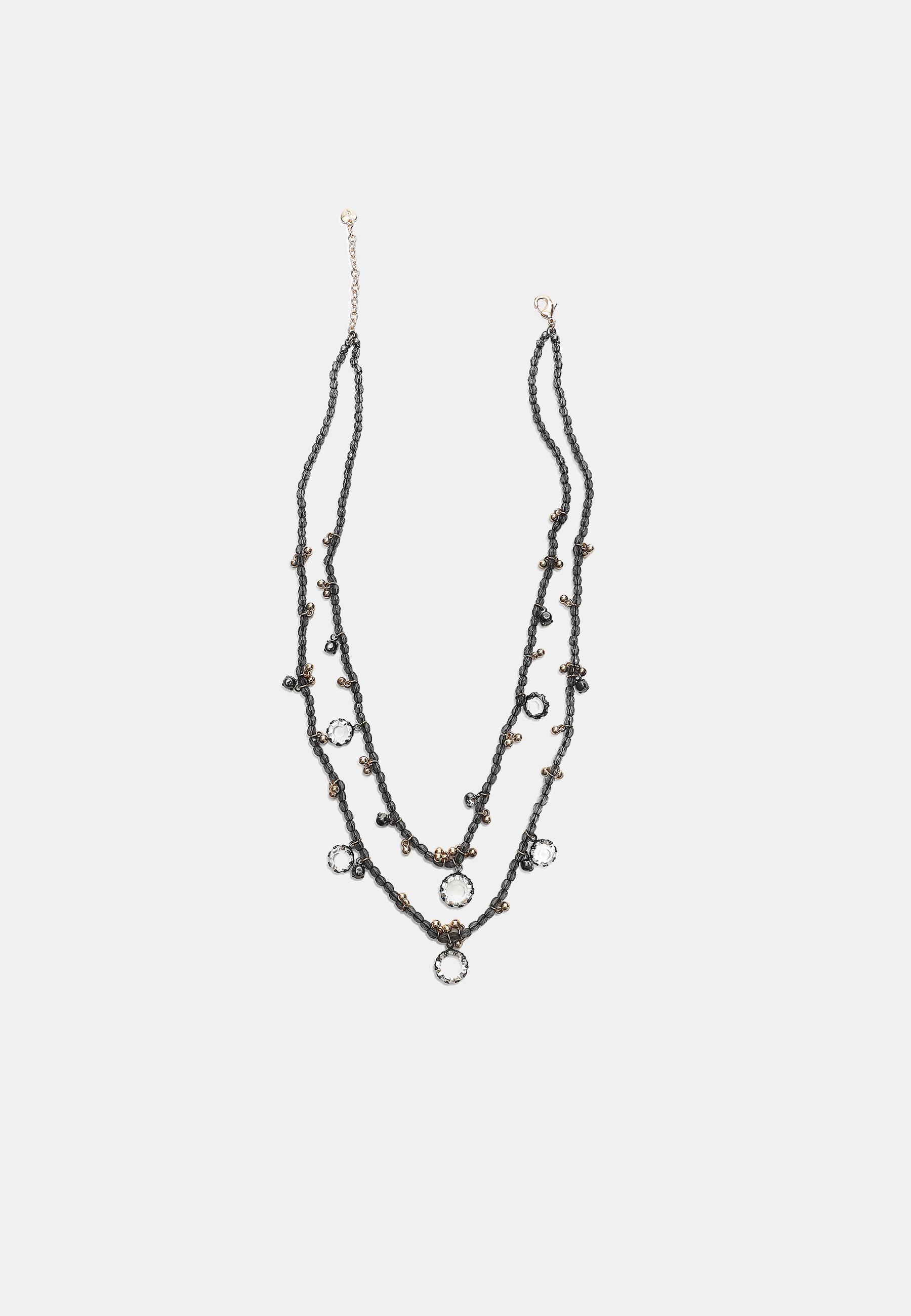 Beaded necklace — Grey