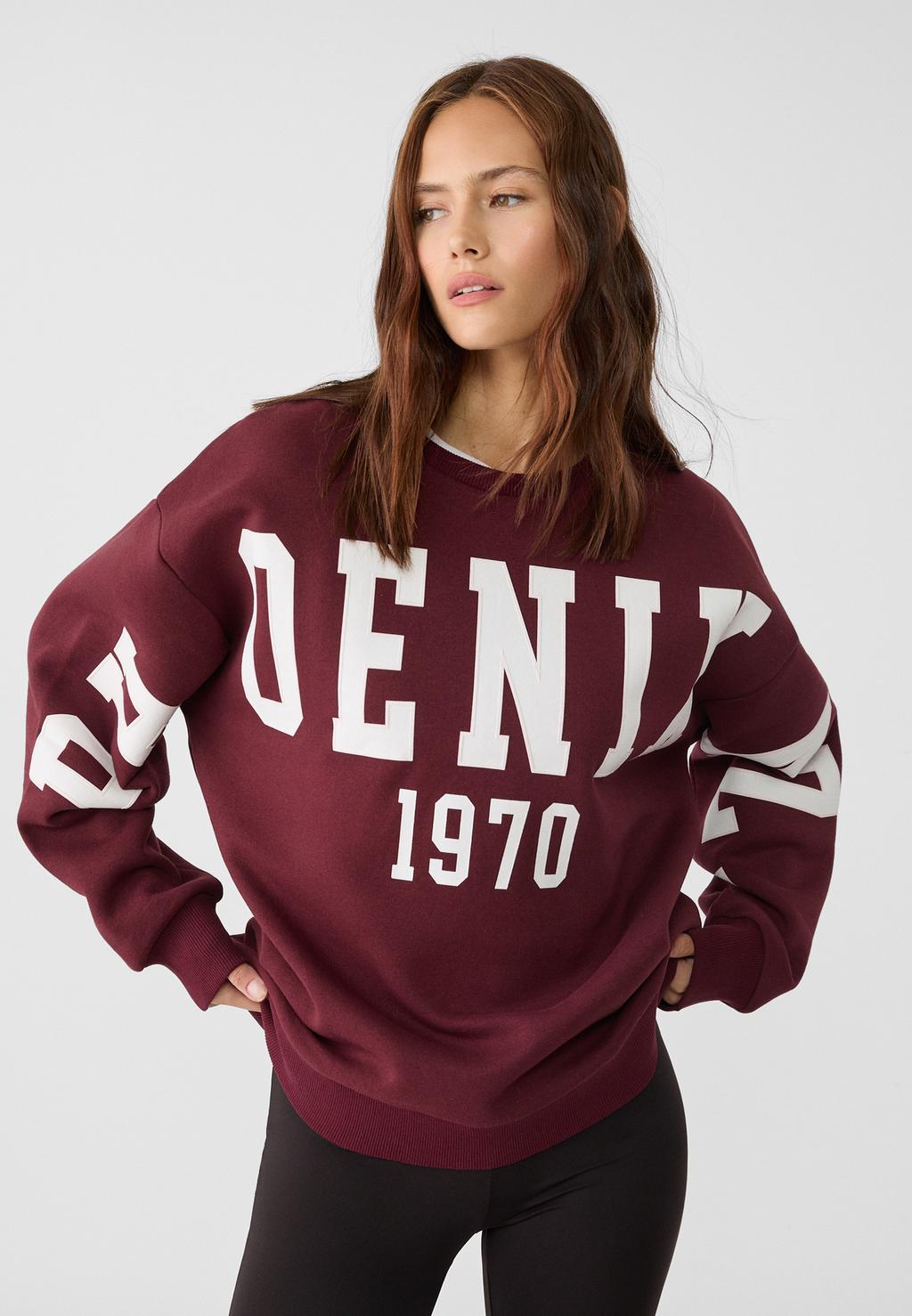 Sweatshirt with printed slogan