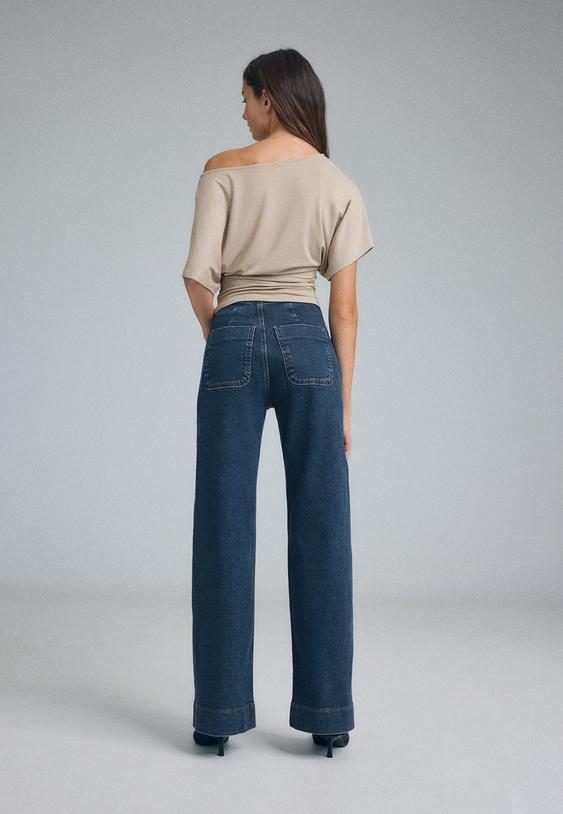 jeans minimalistas d77 com bolsos