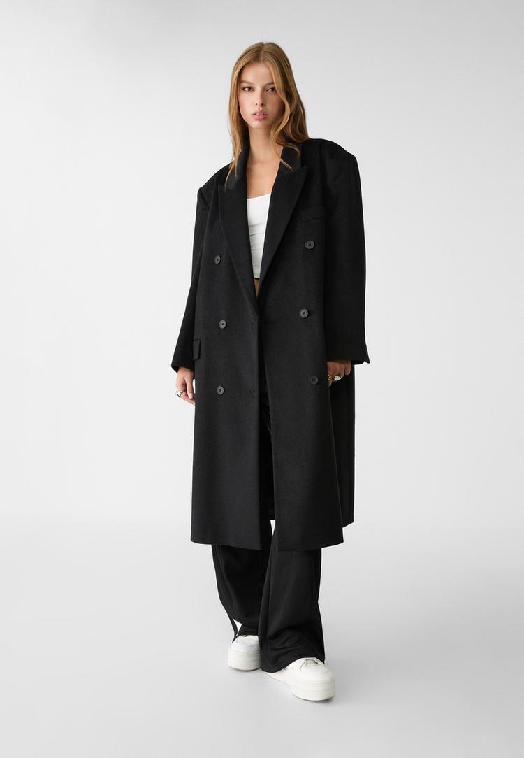 abrigo largo oversize bolsillos