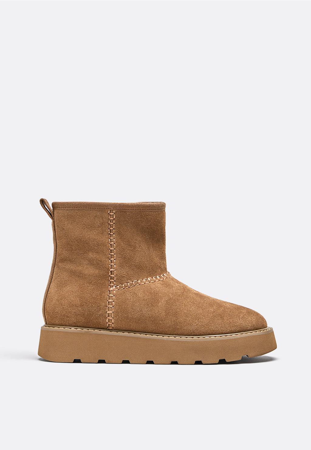 Flat leather ankle boots with fur lining