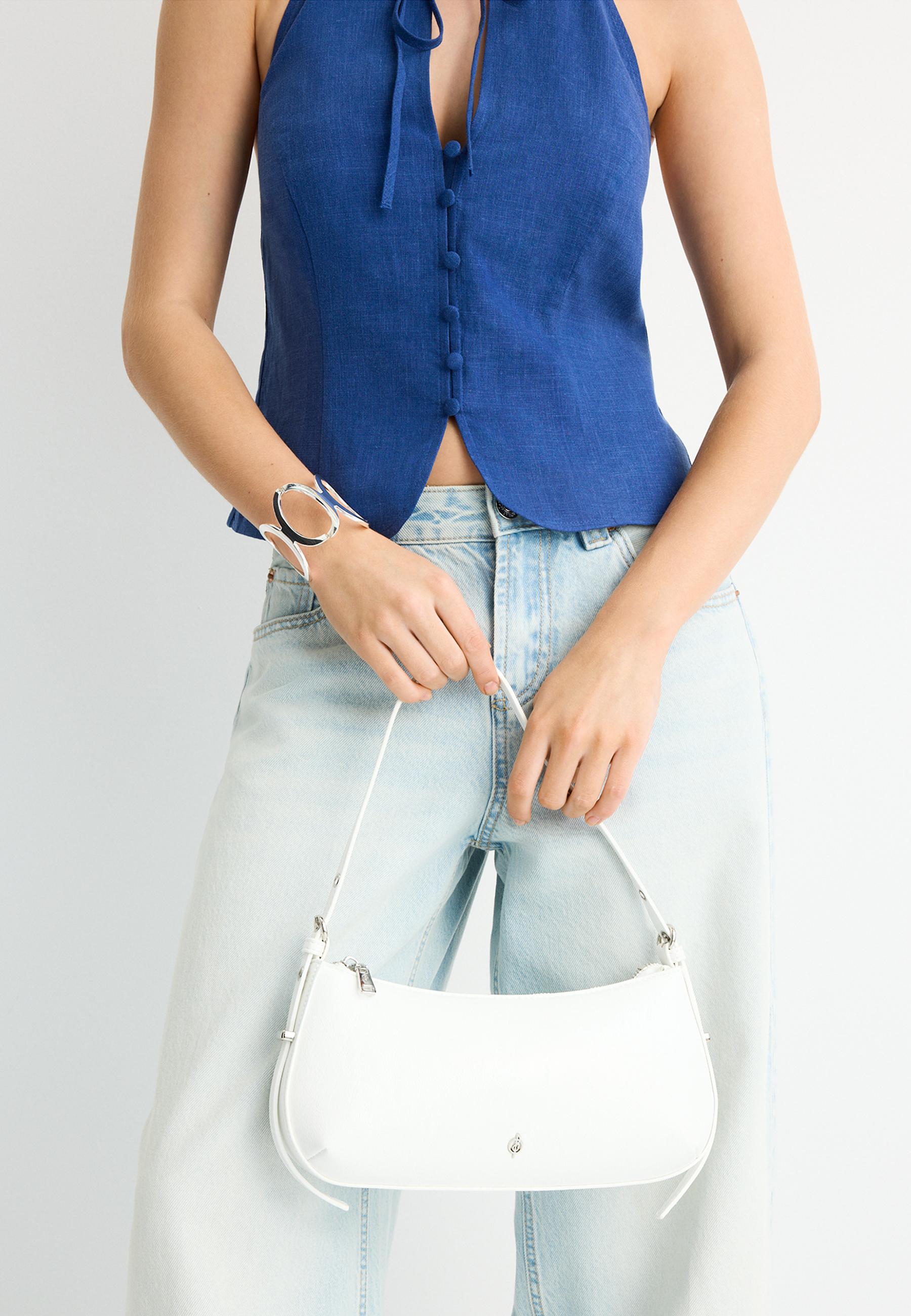 Elongated eyelet shoulder bag — White