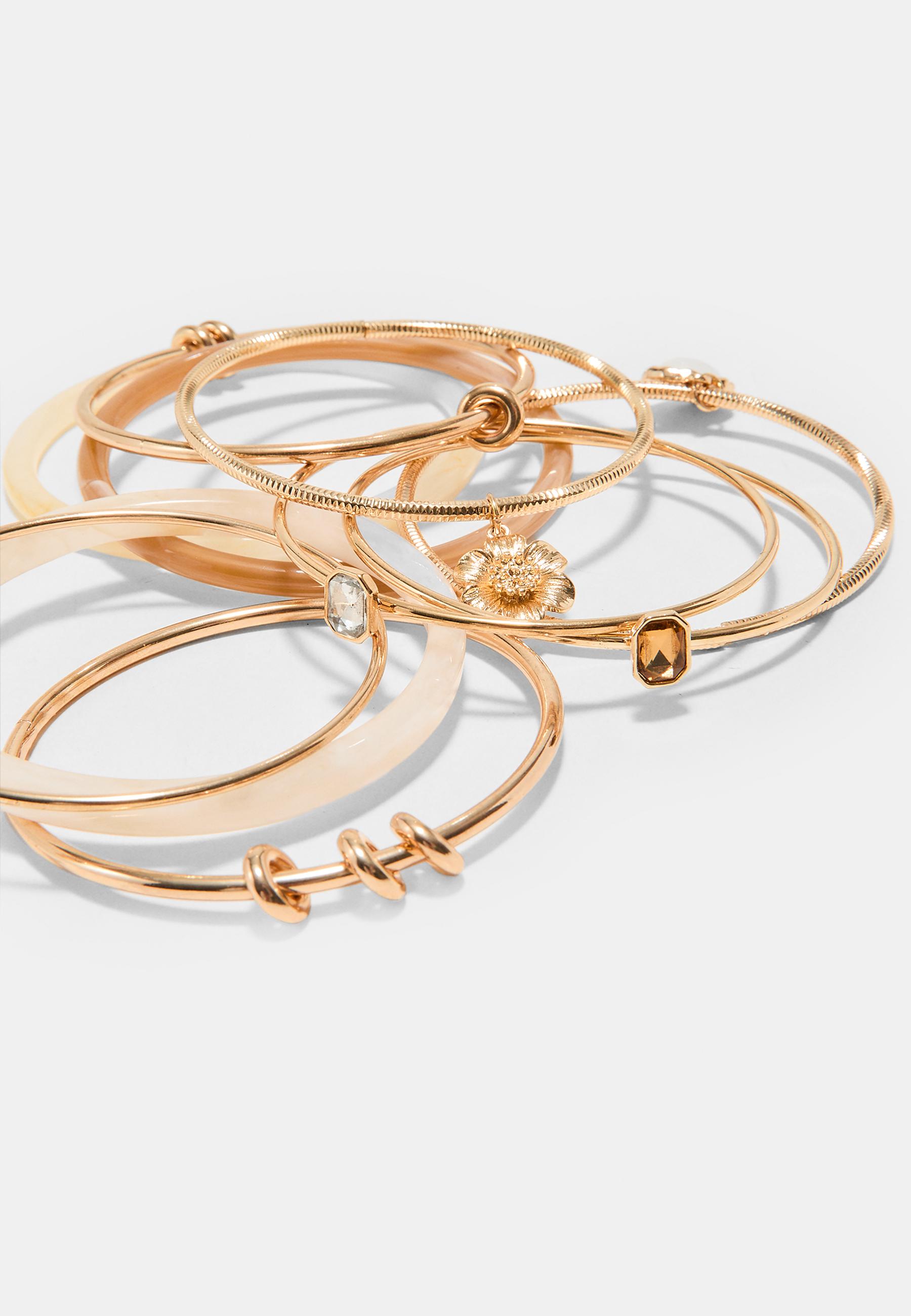 Set of 10 multi-charm bracelets — Gold