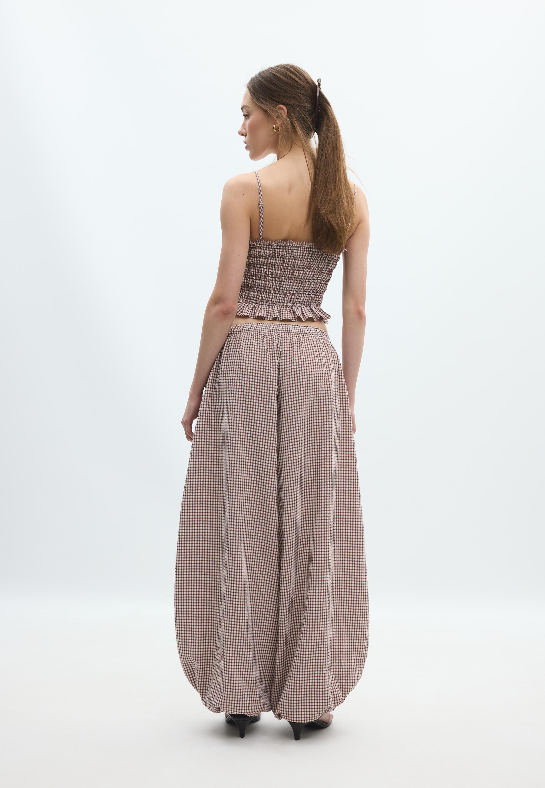 Checked print voluminous trousers — Terracotta