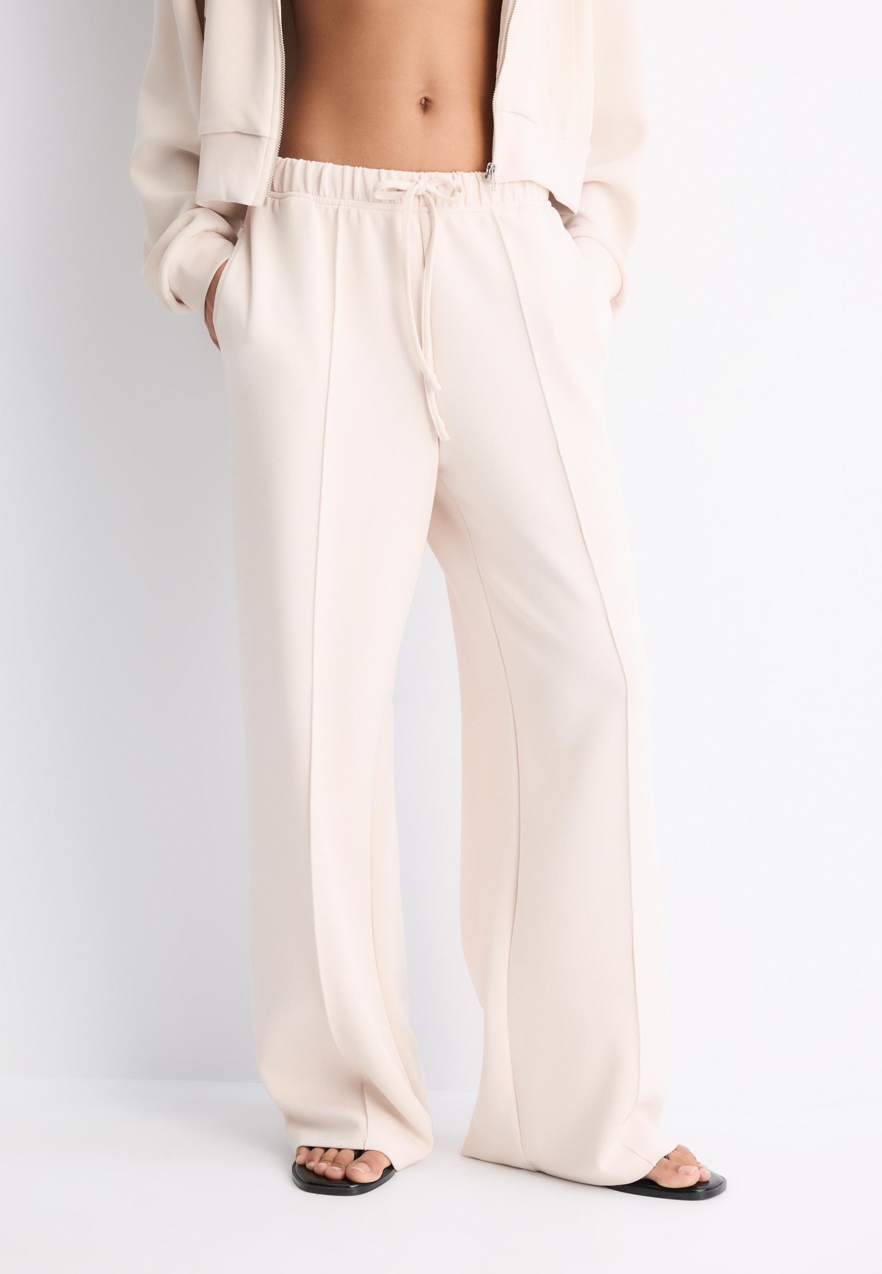 Soft-touch wide-leg pin-tuck joggers — Stone