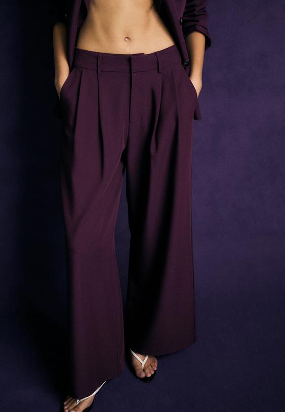 pantaloni eleganti wide leg con bottoni regolabili