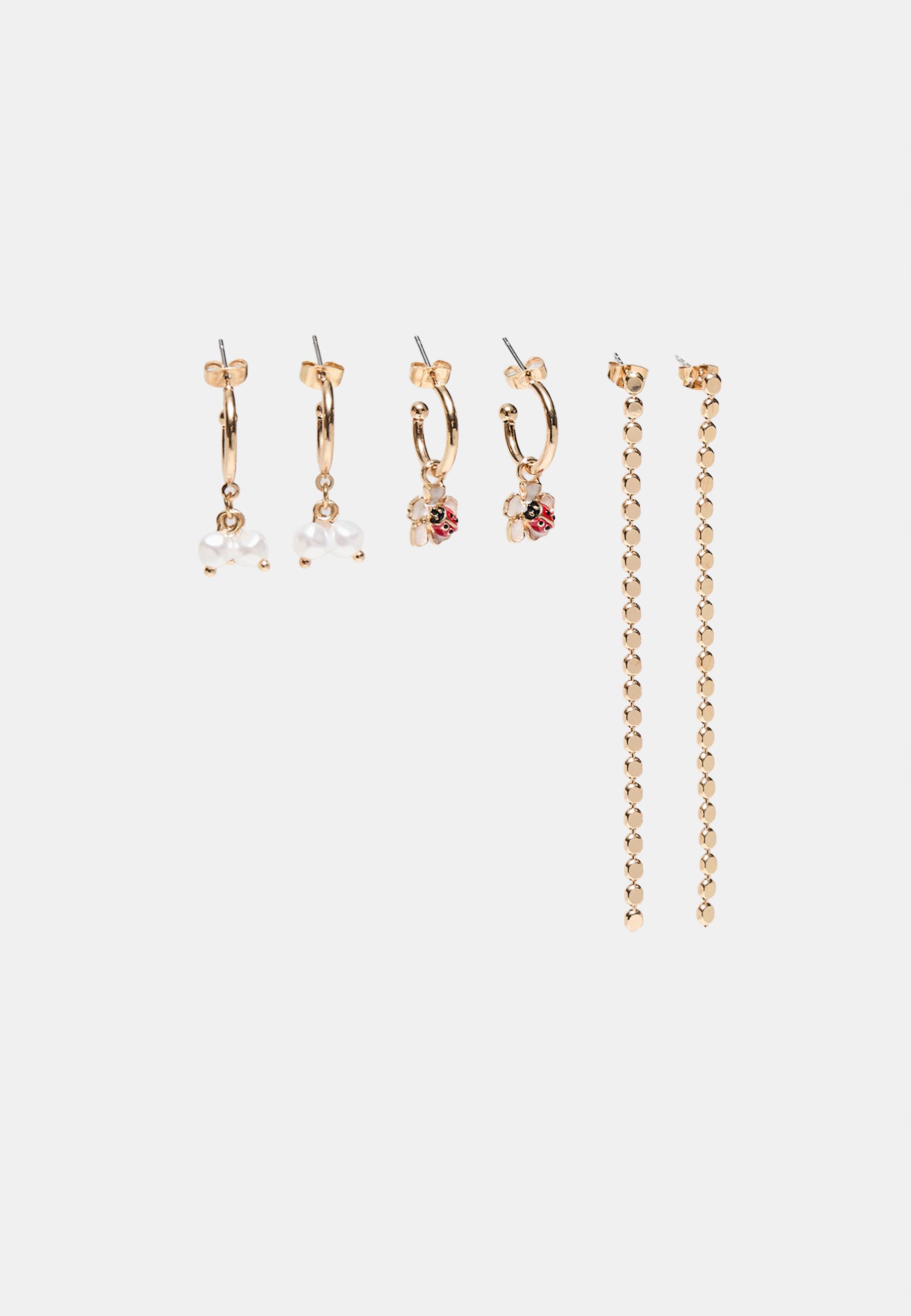9-pack of ladybird earrings — Gold