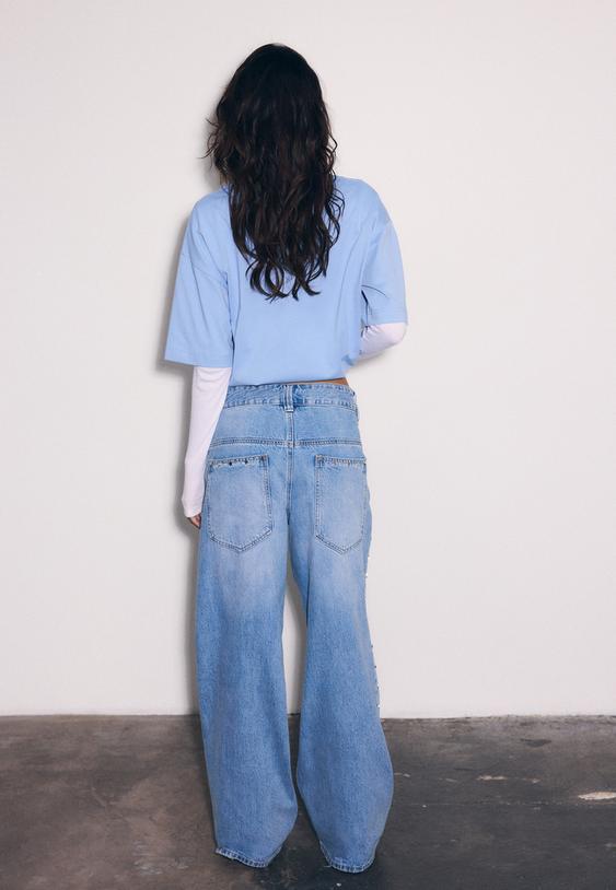 jeans super baggy com estrelas laterais