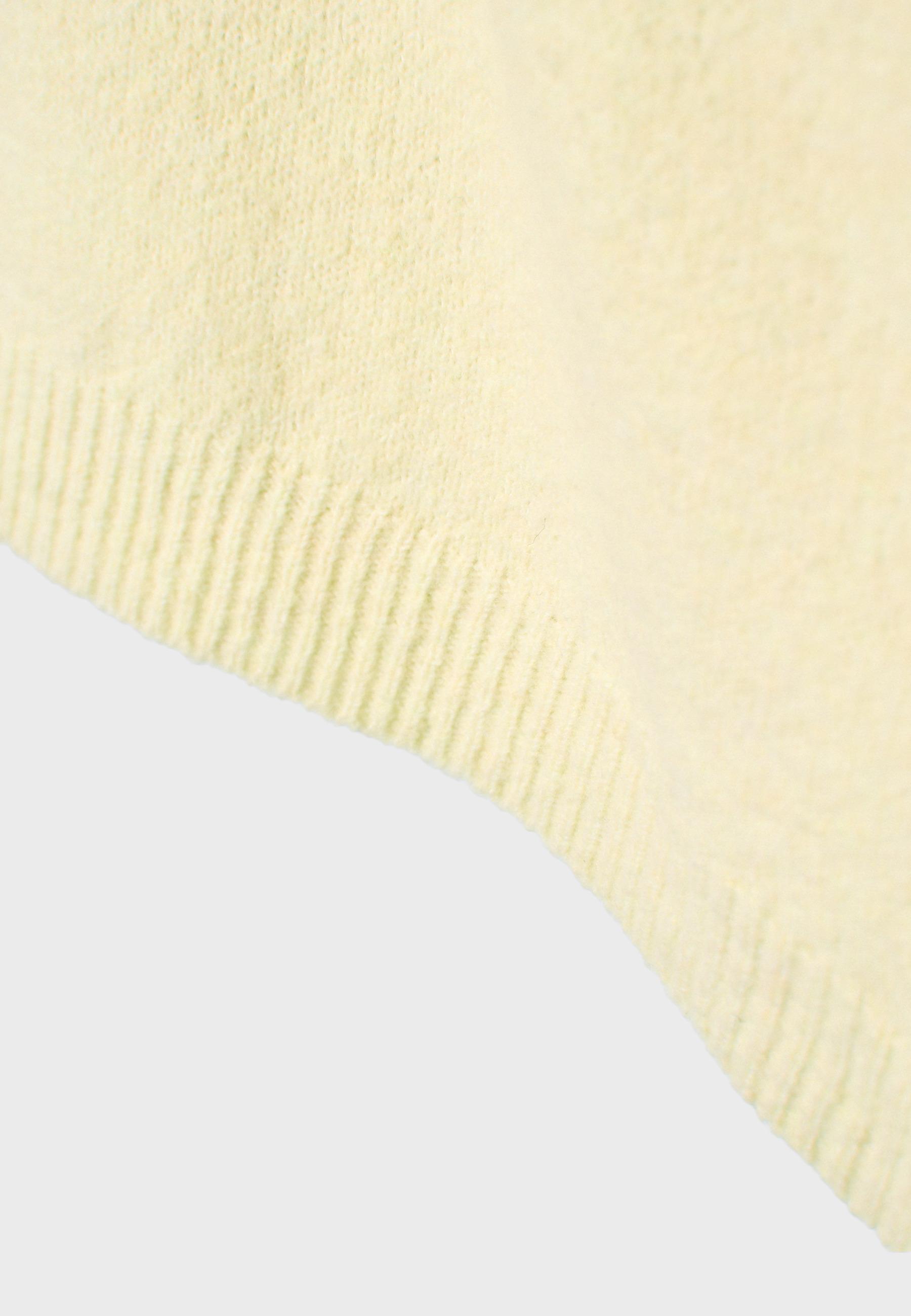 Asymmetric knit sweater — Pastel yellow