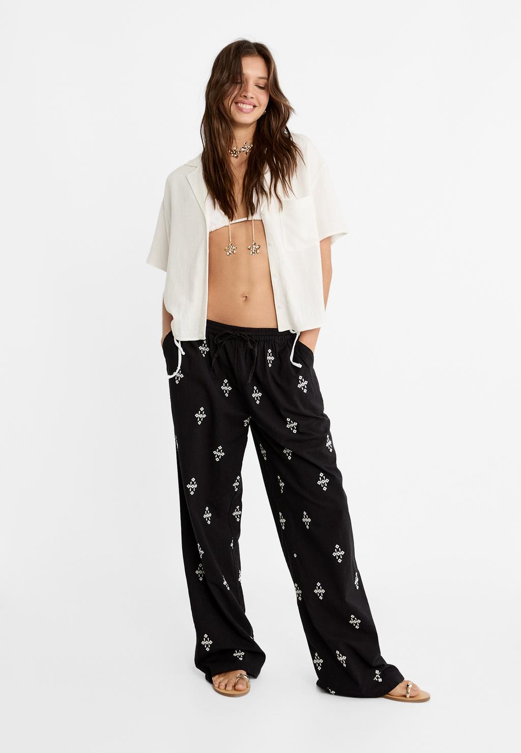 Embroidered trousers with elasticated waistband