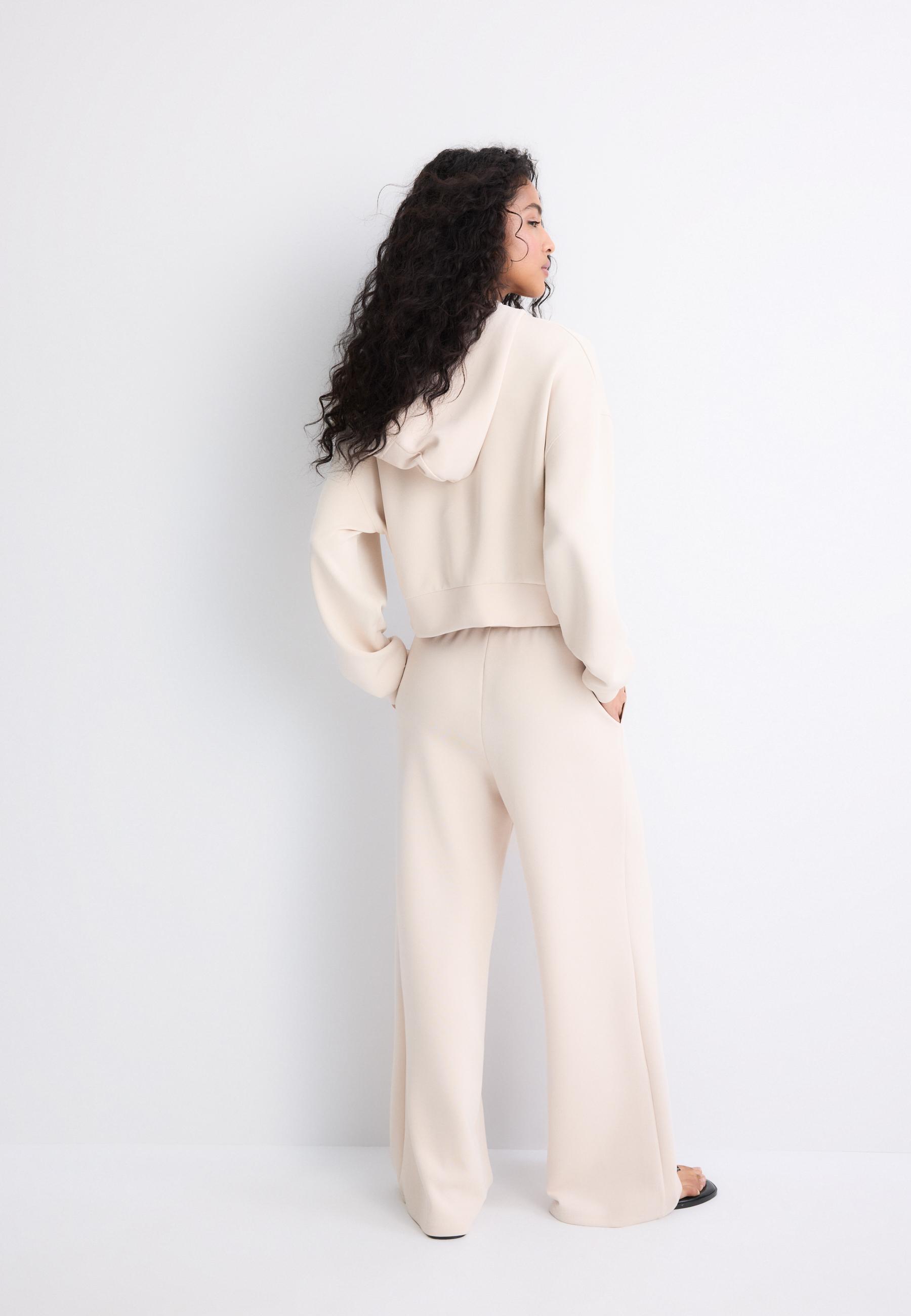 Soft-touch wide-leg pin-tuck joggers — Stone