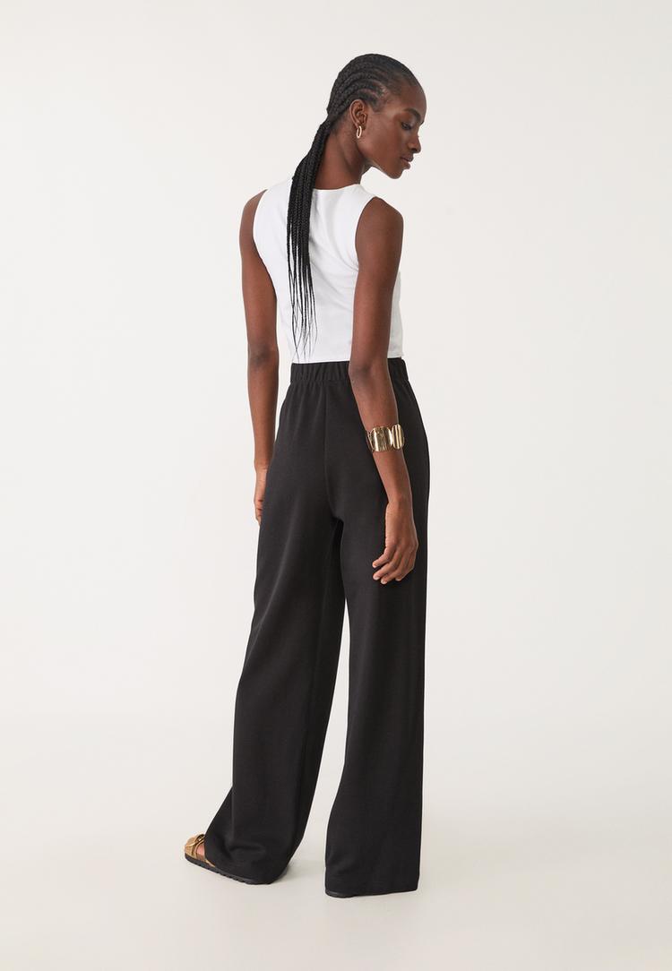 pantalon pinzas punto interlock